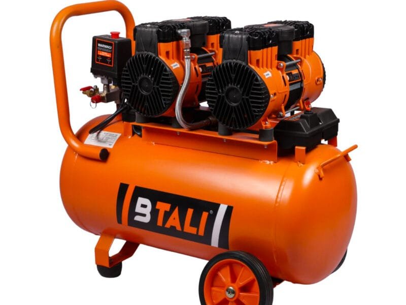 An industrial oil free air compressor for high-precision tools being used in a manufacturing facility in India.